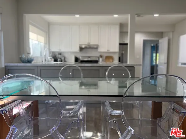 a kitchen with stainless steel appliances granite countertop a sink and a stove