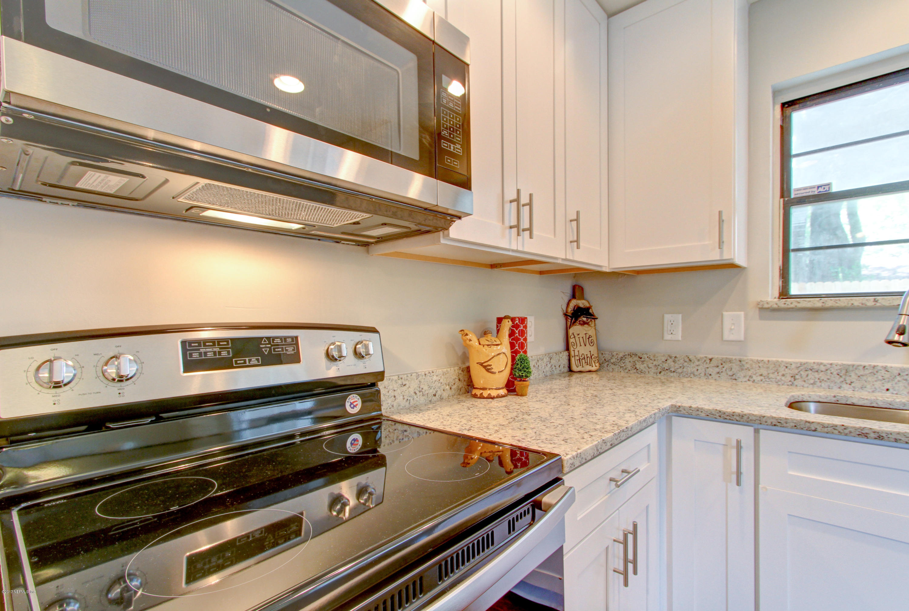 8236 Cassie Road Jacksonville, FL 32221 - Photo 12 of 29 a kitchen with a stove and a sink