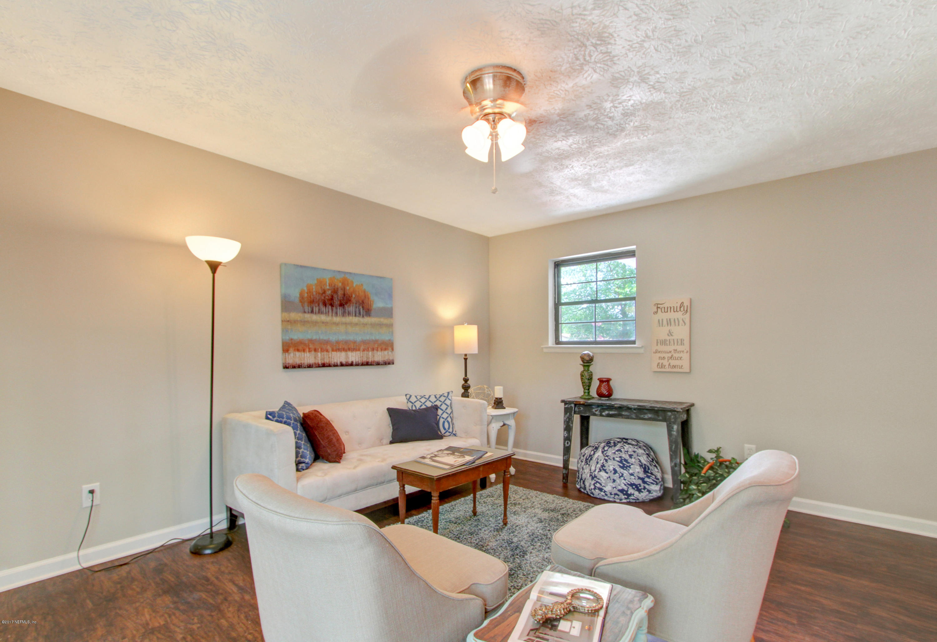 8236 Cassie Road Jacksonville, FL 32221 - Photo 17 of 29 a living room with furniture and a table