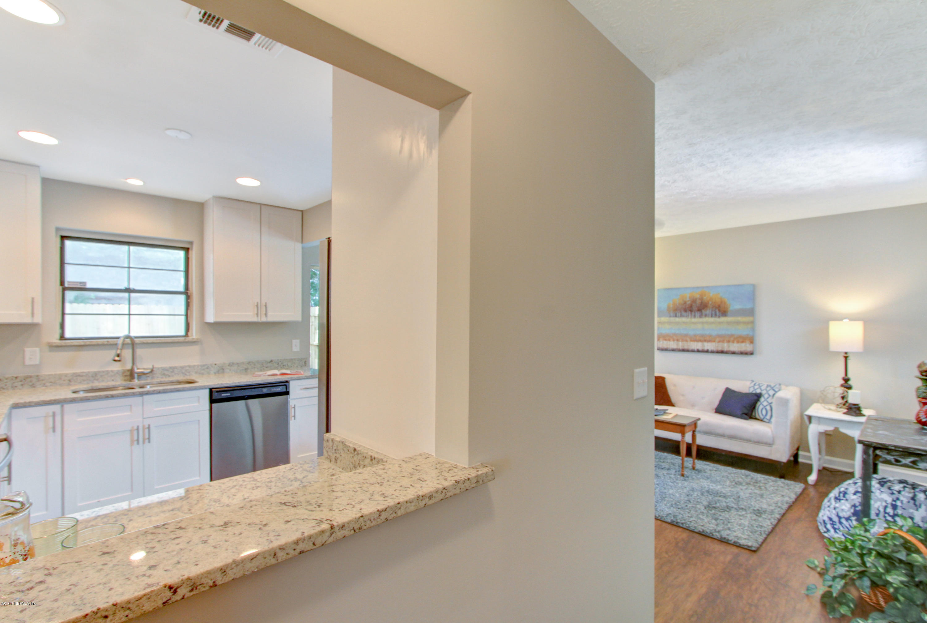 8236 Cassie Road Jacksonville, FL 32221 - Photo 21 of 29 a kitchen with a refrigerator and a sink
