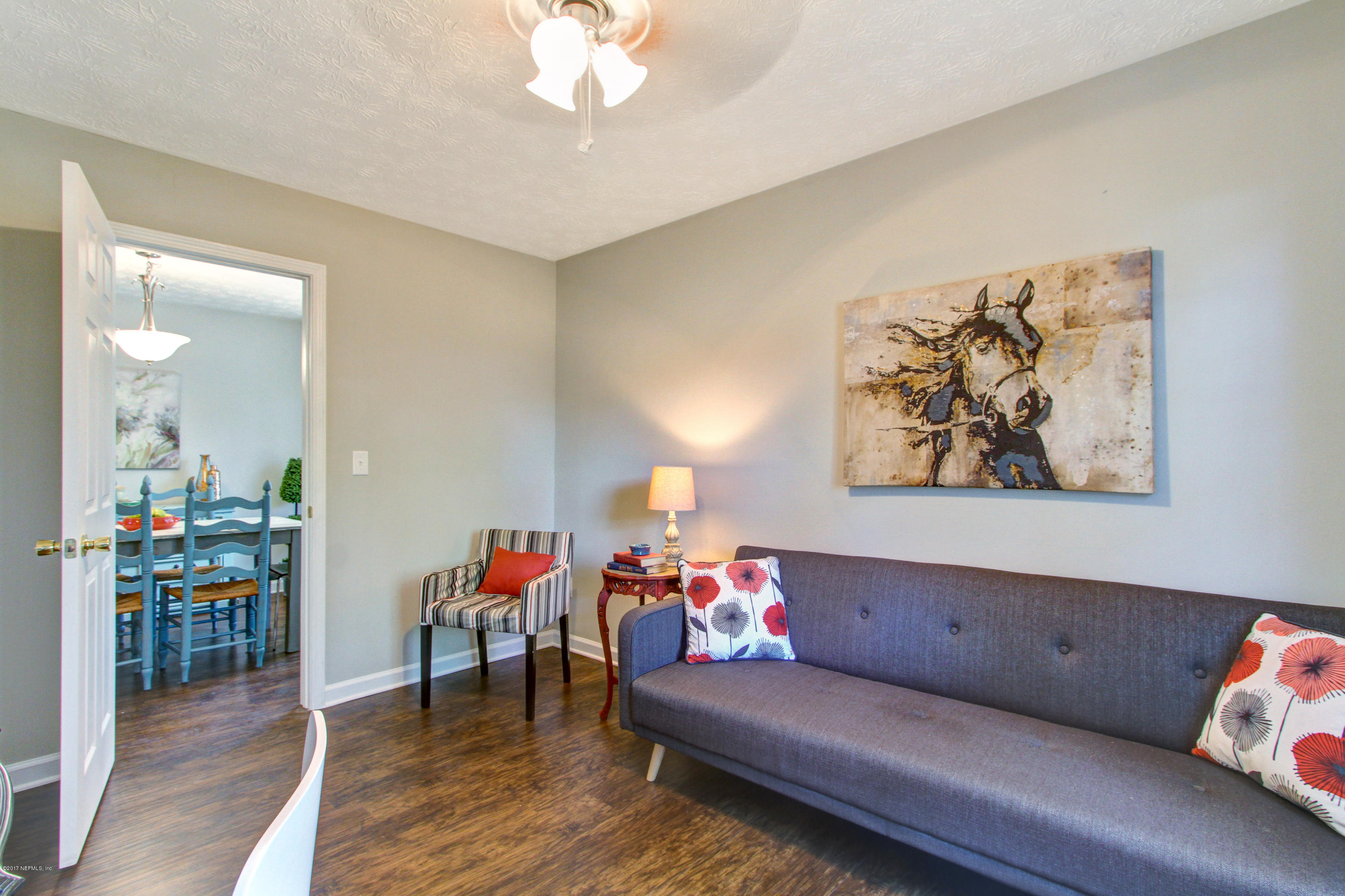 8236 Cassie Road Jacksonville, FL 32221 - Photo 24 of 29 a living room with furniture and a wooden floor