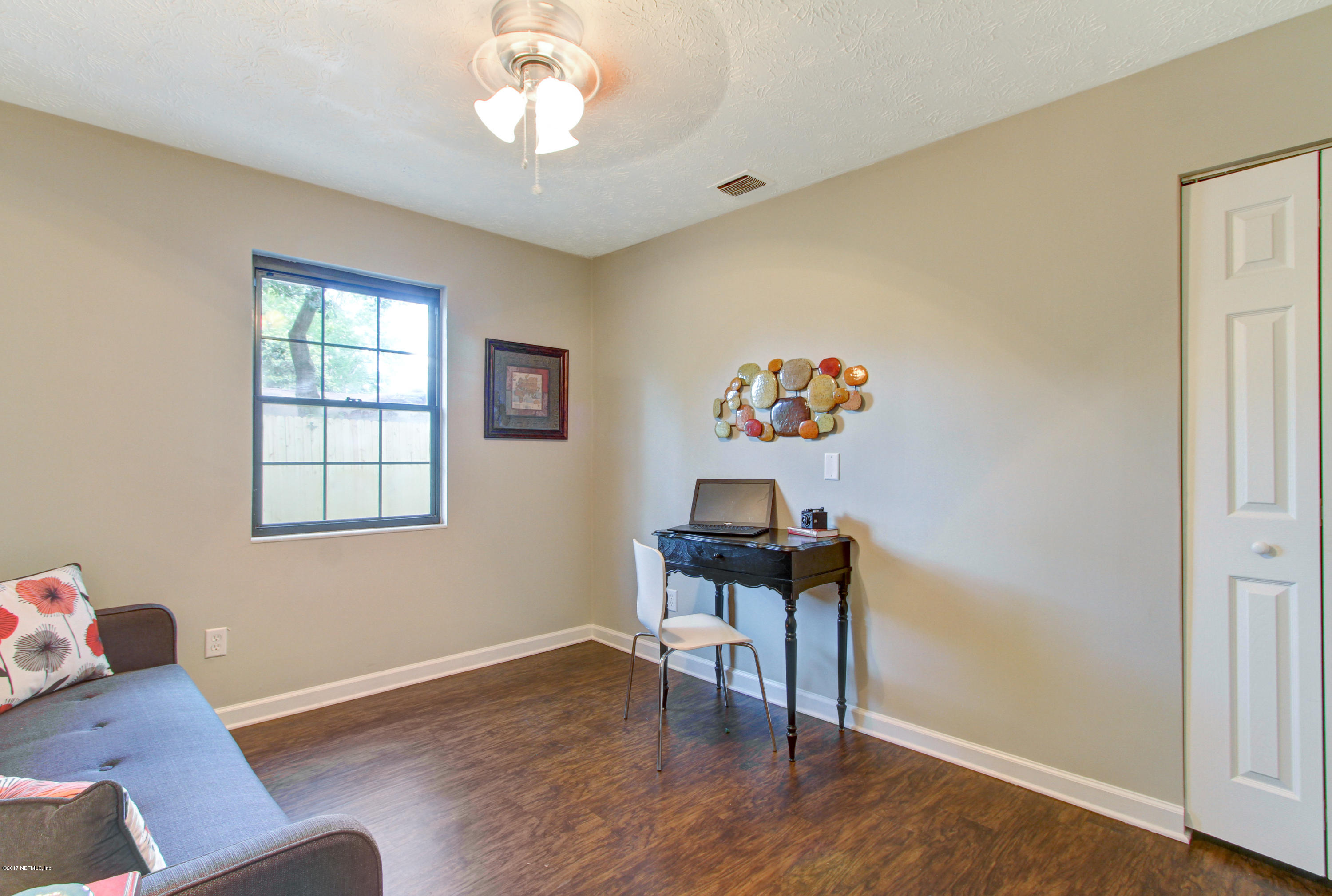 8236 Cassie Road Jacksonville, FL 32221 - Photo 25 of 29 a view of a workspace with furniture and a window