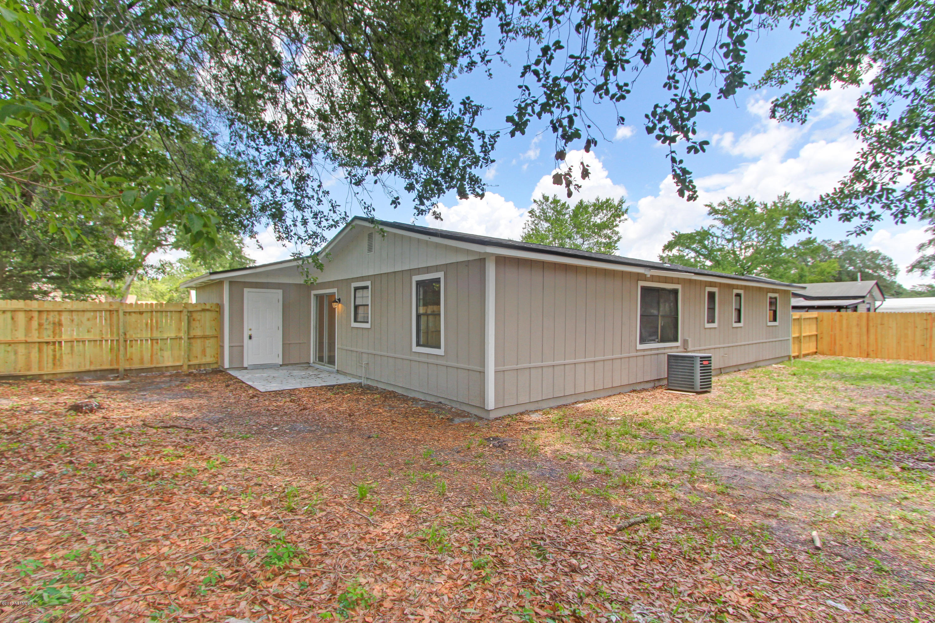 8236 Cassie Road Jacksonville, FL 32221 - Photo 26 of 29 a house with trees in the background