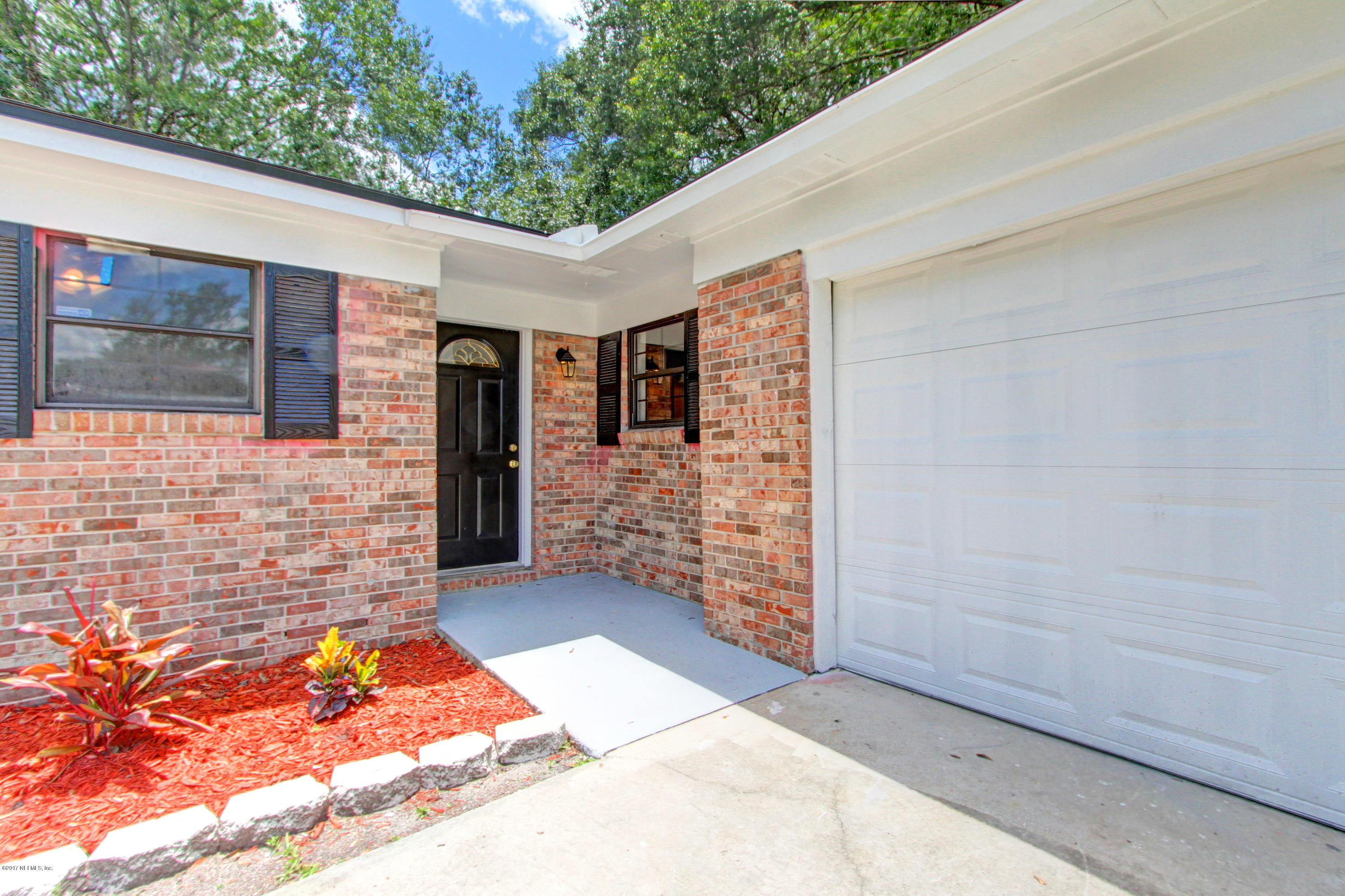 8236 Cassie Road Jacksonville, FL 32221 - Photo 4 of 29 a backyard of a house with outdoor seating