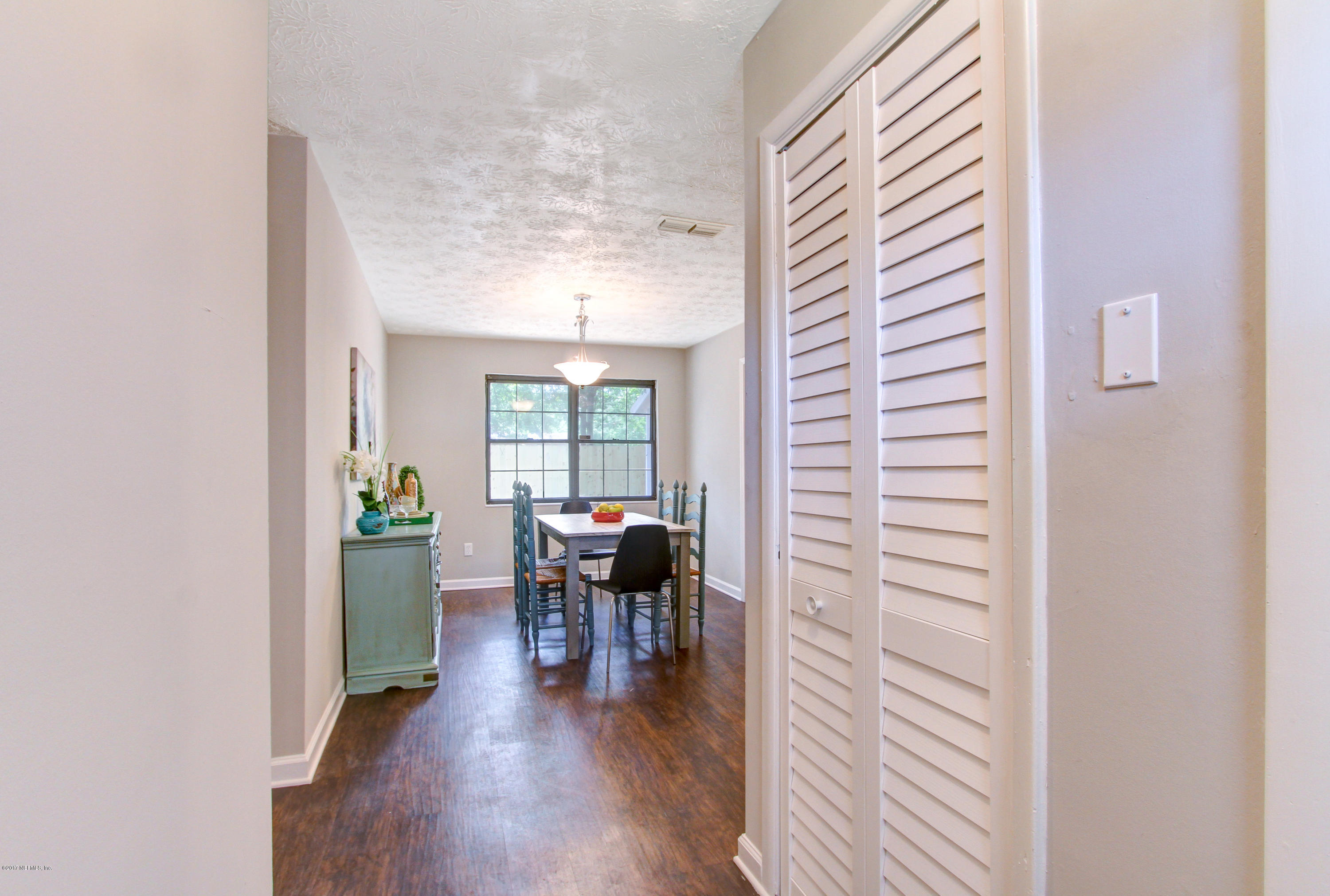 8236 Cassie Road Jacksonville, FL 32221 - Photo 5 of 29 a dining room with furniture and wooden floor