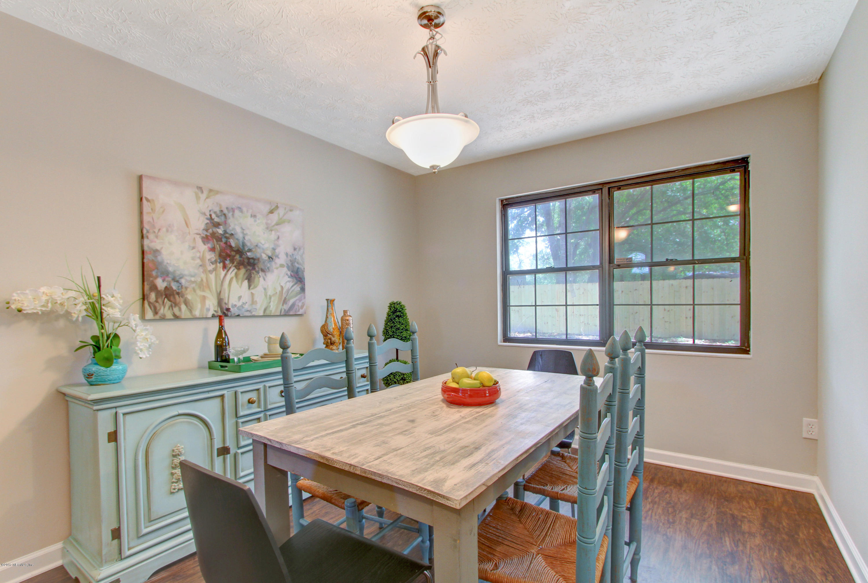 8236 Cassie Road Jacksonville, FL 32221 - Photo 7 of 29 a view of a dining room with furniture window and wooden floor