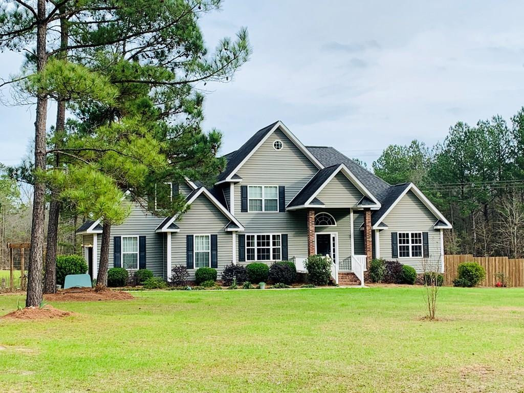 164 Hamelin Road Aiken, SC 29805 - Photo 38 of 38 a front view of a house with a yard and trees