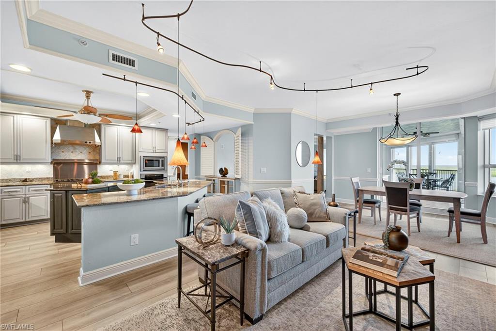 285 Grande Way, Unit 804 Naples, FL 34110 - Photo 50 of 50 a living room with lots of furniture and kitchen view