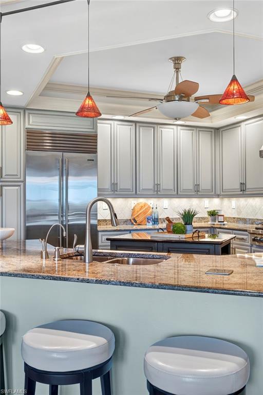 285 Grande Way, Unit 804 Naples, FL 34110 - Photo 15 of 50 a kitchen with stainless steel appliances granite countertop a sink a stove and cabinets