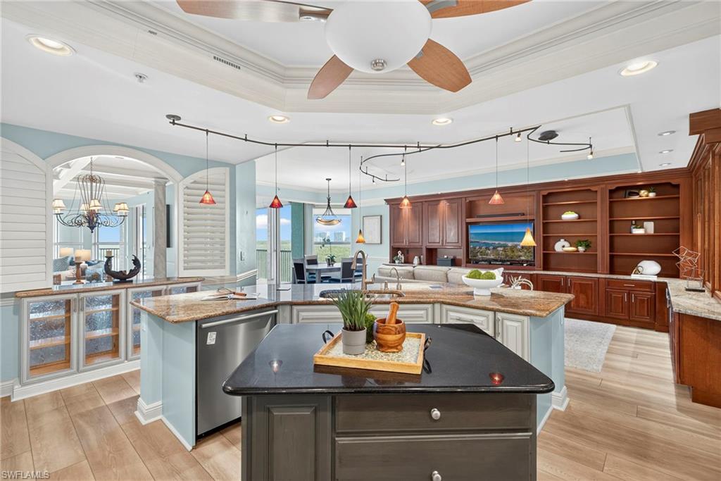 285 Grande Way, Unit 804 Naples, FL 34110 - Photo 16 of 50 a kitchen with a sink a counter space appliances and cabinets