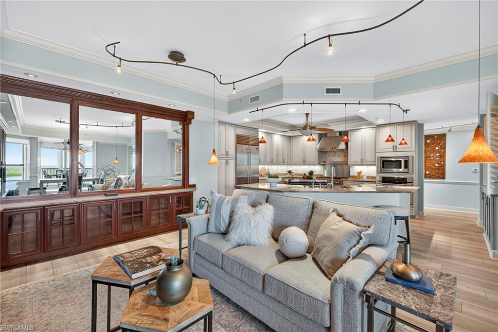 285 Grande Way, Unit 804 Naples, FL 34110 - Photo 17 of 50 a living room with furniture and a large window
