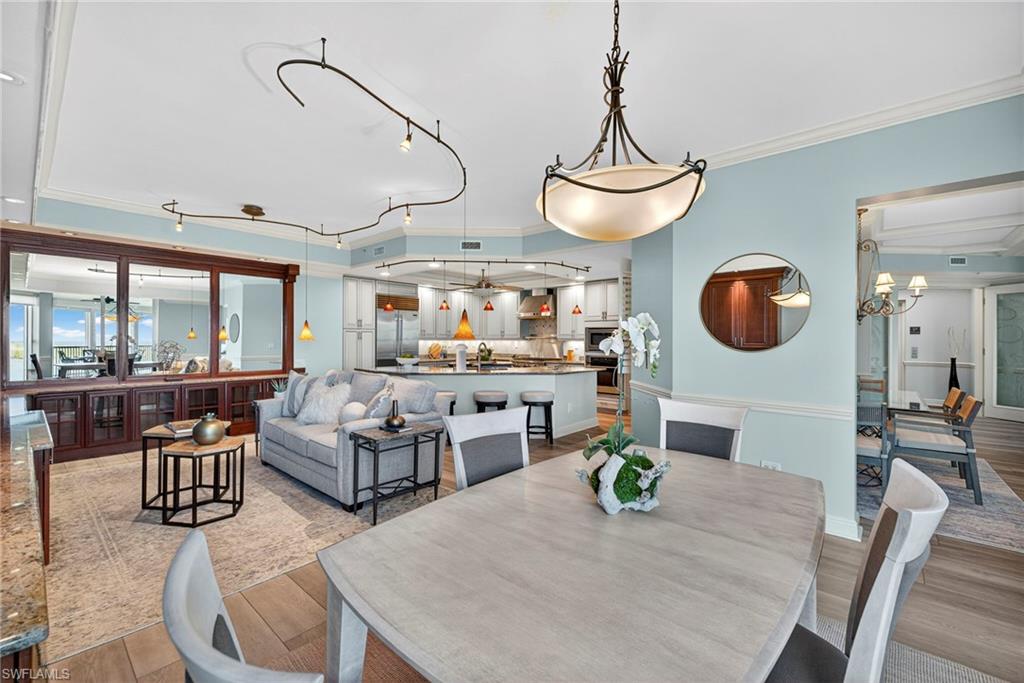 285 Grande Way, Unit 804 Naples, FL 34110 - Photo 20 of 50 a living room with fireplace furniture and a large window