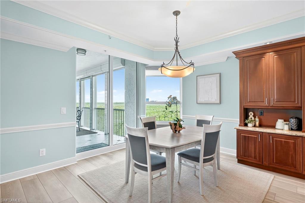 285 Grande Way, Unit 804 Naples, FL 34110 - Photo 21 of 50 a view of a dining room with furniture window and outside view