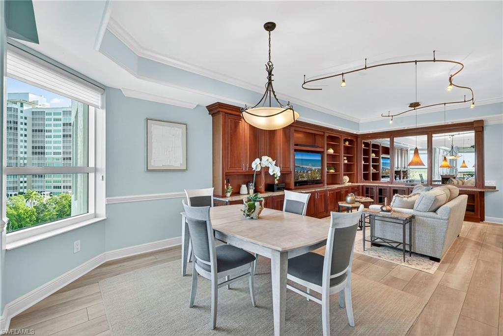 285 Grande Way, Unit 804 Naples, FL 34110 - Photo 22 of 50 a view of a dining room with furniture window and outside view