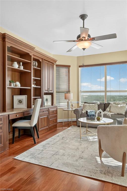 285 Grande Way, Unit 804 Naples, FL 34110 - Photo 25 of 50 a living room with furniture kitchen view and large windows