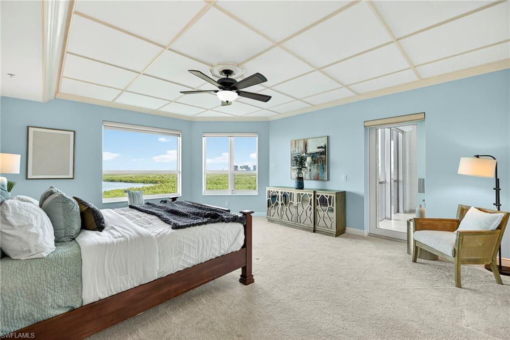 285 Grande Way, Unit 804 Naples, FL 34110 - Photo 27 of 50 a bedroom with a bed a couch and dresser