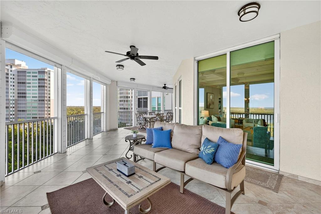 285 Grande Way, Unit 804 Naples, FL 34110 - Photo 36 of 50 a living room with furniture and a large window