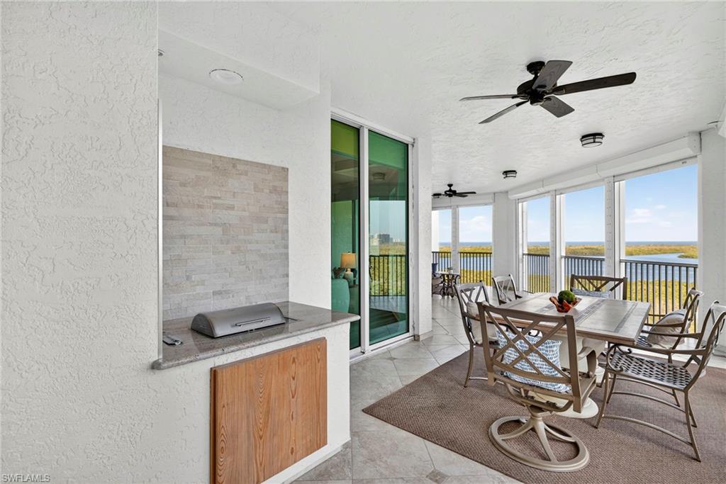 285 Grande Way, Unit 804 Naples, FL 34110 - Photo 37 of 50 a view of a dining room with furniture window and outside view