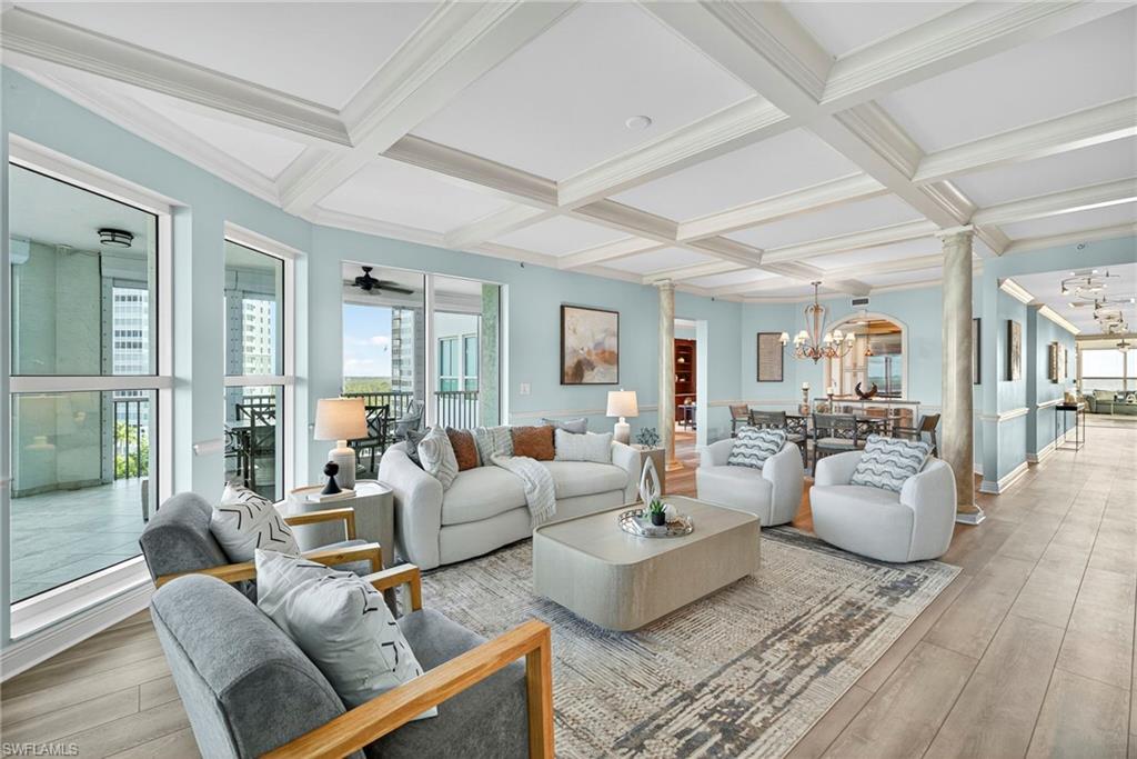 285 Grande Way, Unit 804 Naples, FL 34110 - Photo 6 of 50 a living room with furniture and a table