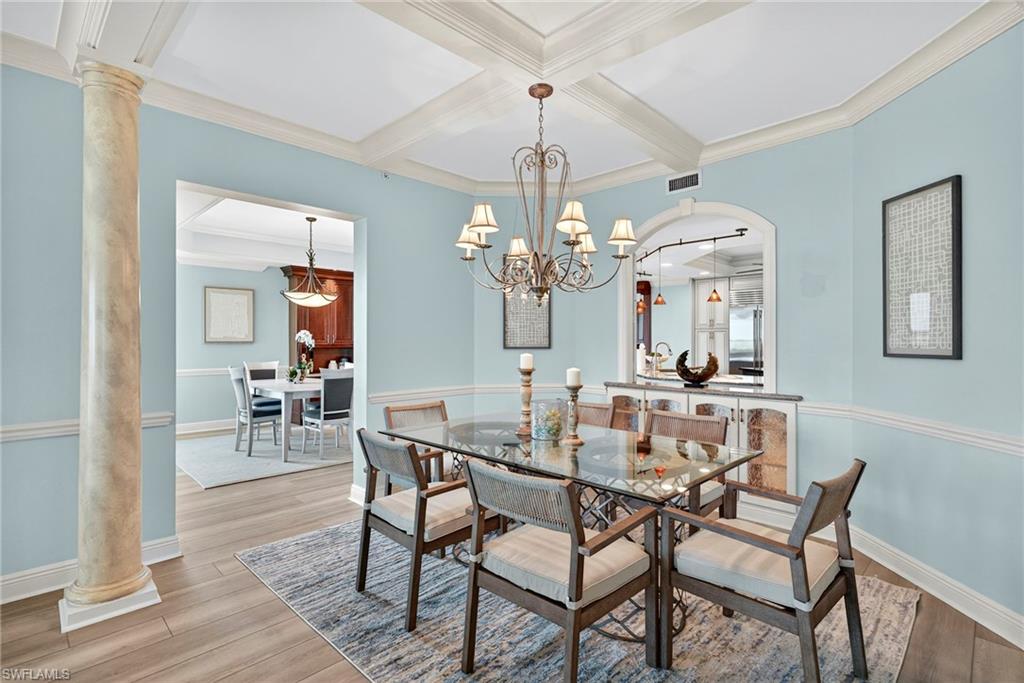 285 Grande Way, Unit 804 Naples, FL 34110 - Photo 10 of 50 a view of a dining room with furniture and chandelier