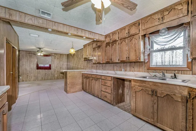a kitchen with a sink and cabinets