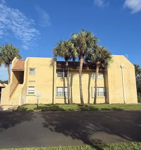 a view of a house with a street