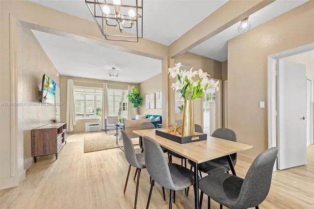 a view of a dining room with furniture window and wooden floor