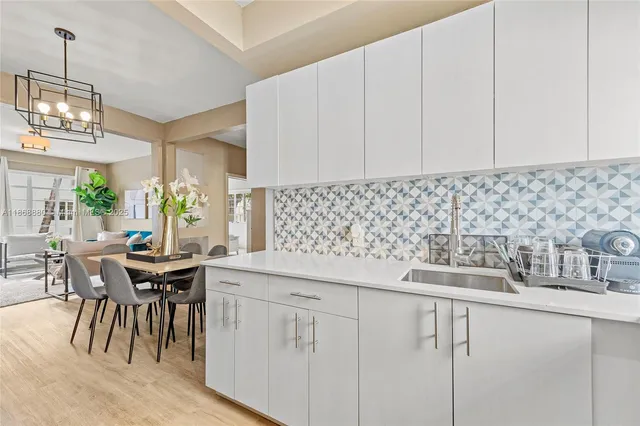a kitchen with a sink and cabinets