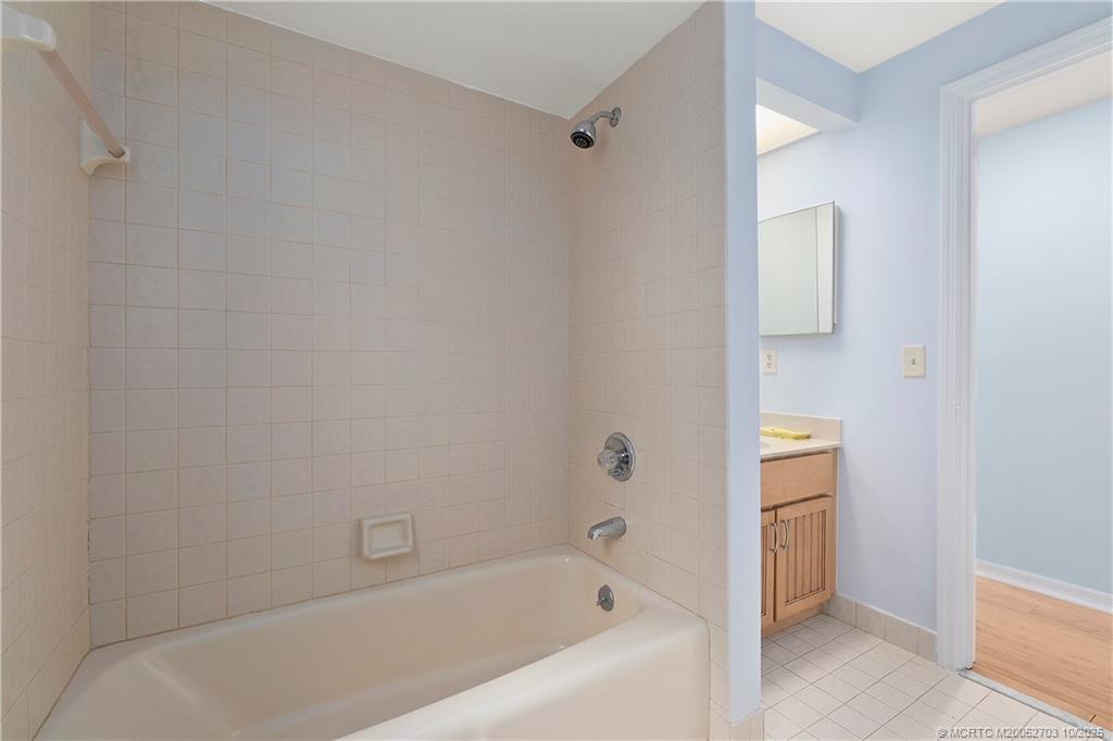 6122 Southeast Landing Way, Unit 4 Stuart, FL 34997 - Photo 12 of 29 a bathroom with a bathtub