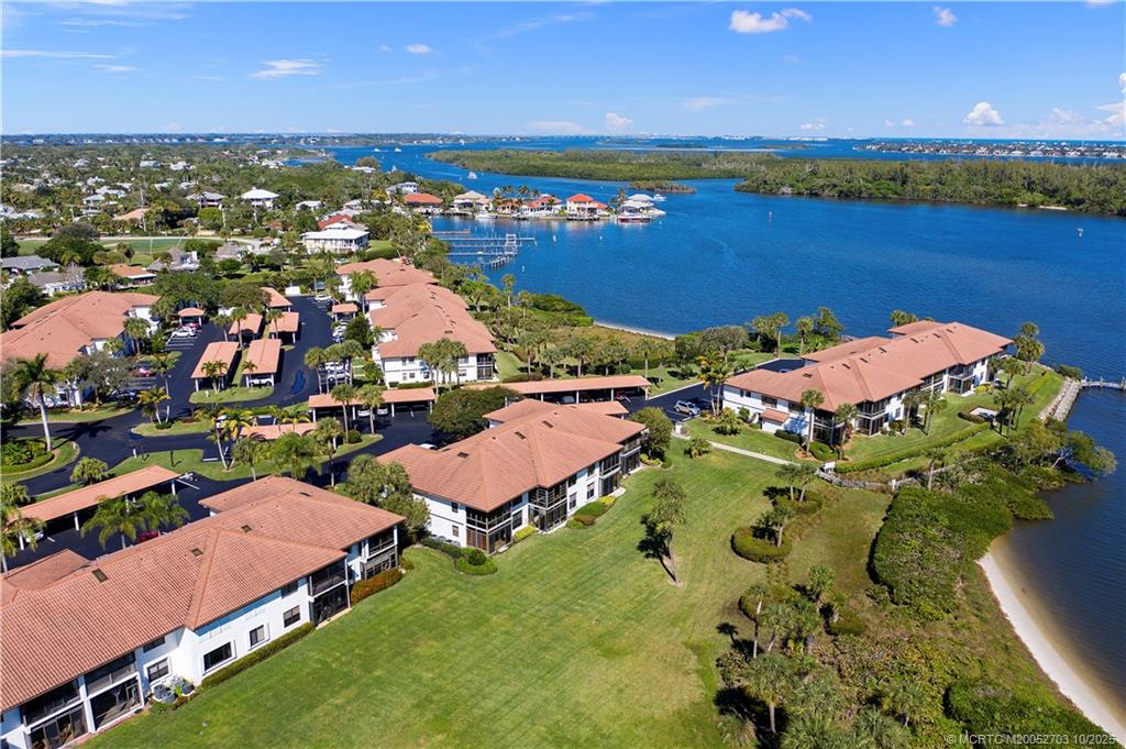 6122 Southeast Landing Way, Unit 4 Stuart, FL 34997 - Photo 23 of 29 an aerial view of residential houses with outdoor space and river