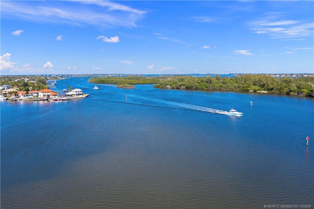 6122 Southeast Landing Way, Unit 4 Stuart, FL 34997 - Photo 25 of 29 a view of an ocean and beach