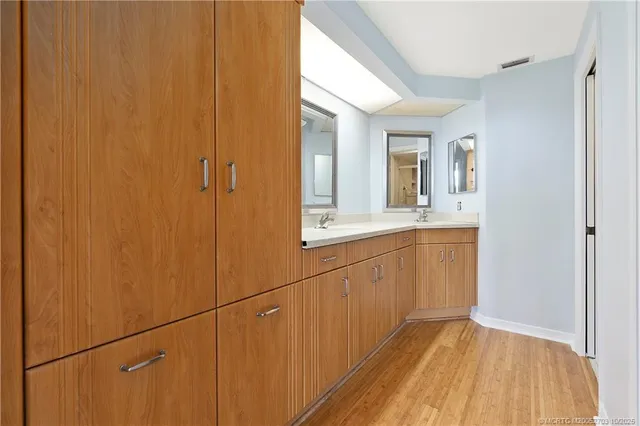 a bathroom with a sink and mirror