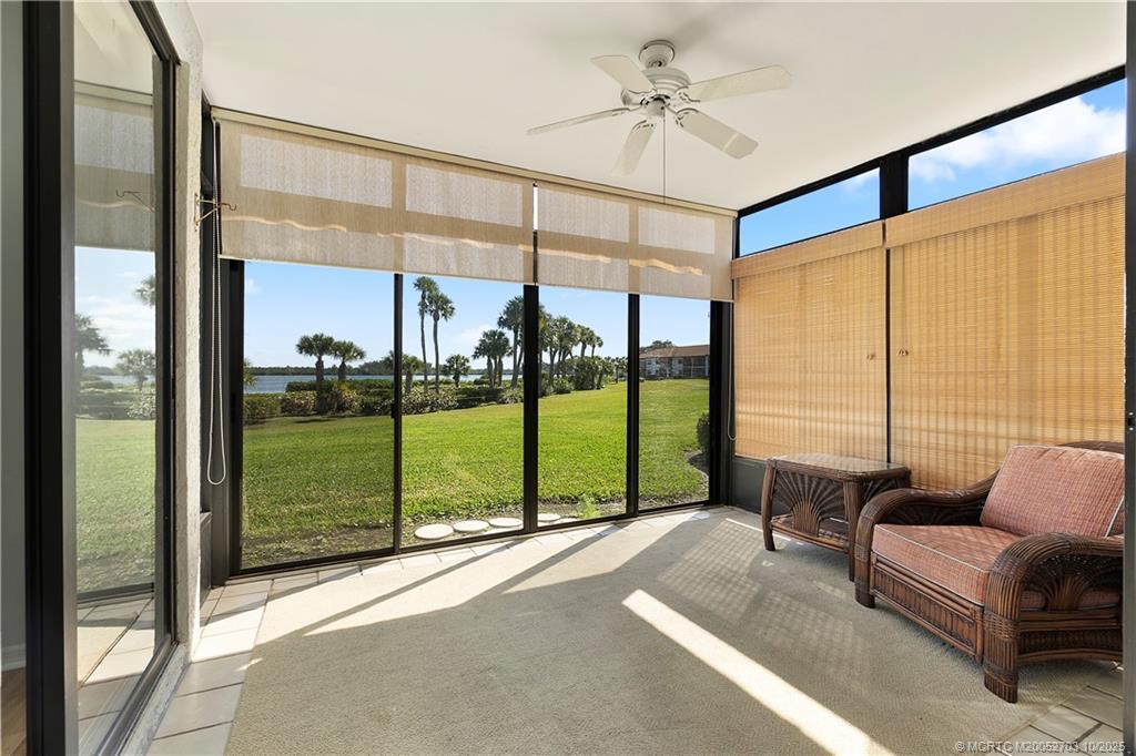 6122 Southeast Landing Way, Unit 4 Stuart, FL 34997 - Photo 10 of 29 a living room with a large window