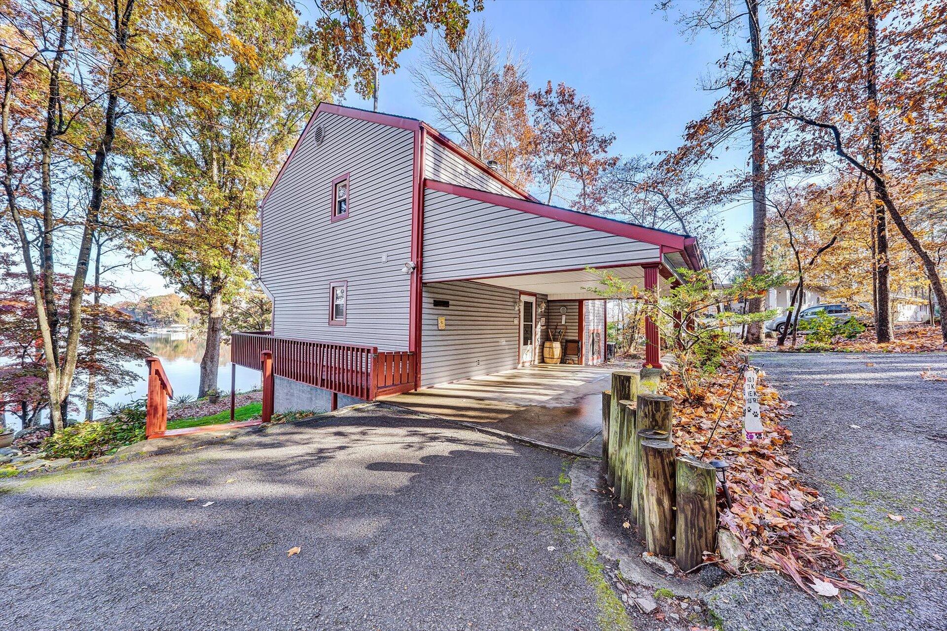 505 Highland Lake Road Union Hall, VA 24176 - Photo 54 of 58 a front view of a house with a yard and trees