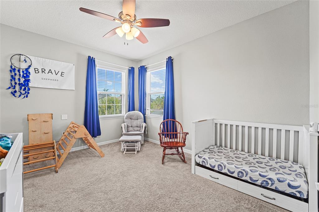 8903 Arabella Lane Seminole, FL 33777 - Photo 27 of 47 a bedroom with furniture and a window