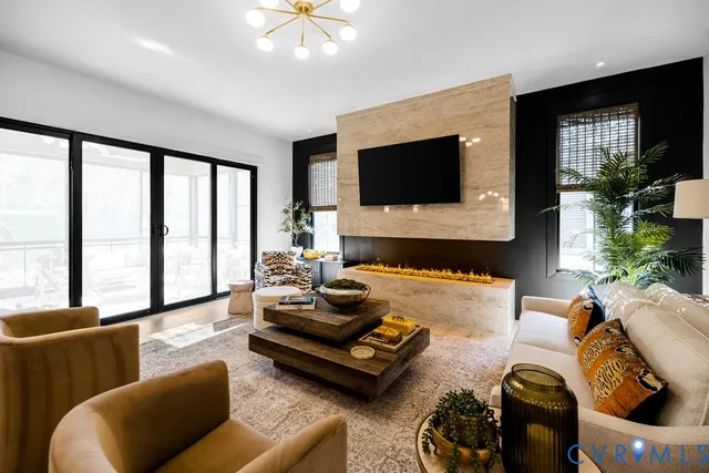 a living room with furniture and large window