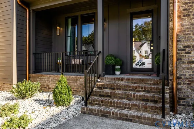 a view of a entryway door front of a house