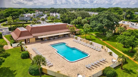 an aerial view of a backyard and outdoor kitchen