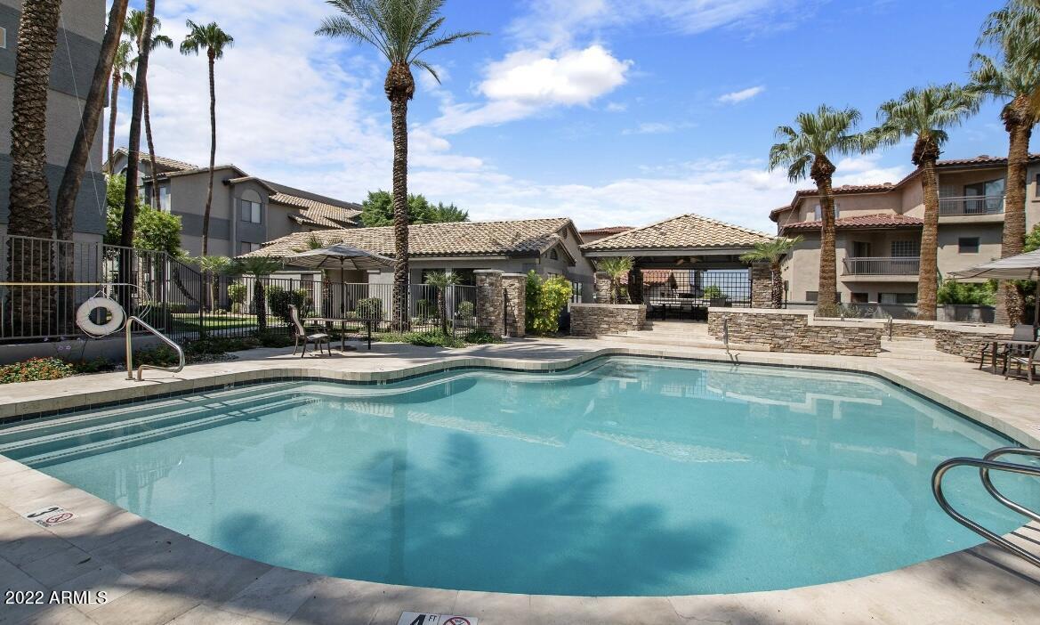 2025 East Campbell Avenue, Unit 363 Phoenix, AZ 85016 - Photo 1 of 18 a swimming pool with outdoor seating yard and barbeque oven