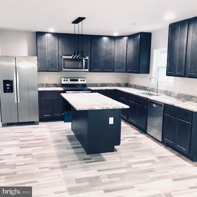 1110 Beach Road Essex, MD 21221 - Photo 6 of 18 Kitchen with eat-in island, granite counter tops