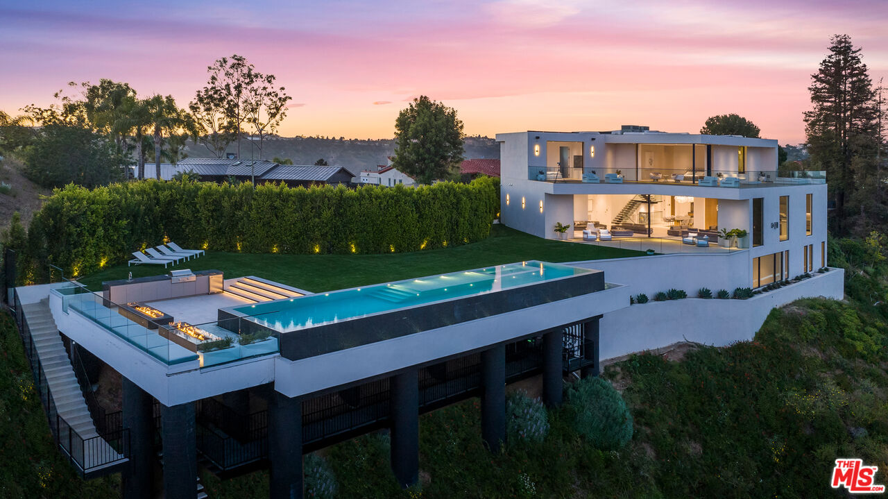 a view of a chairs and table in a patio