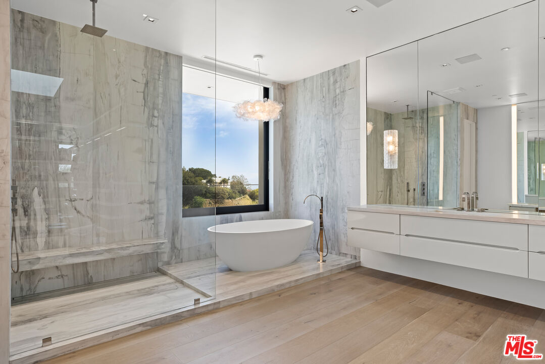 9674 Highridge Drive Beverly Hills, CA 90210 - Photo 13 of 29 a bathroom with a bathtub and a shower