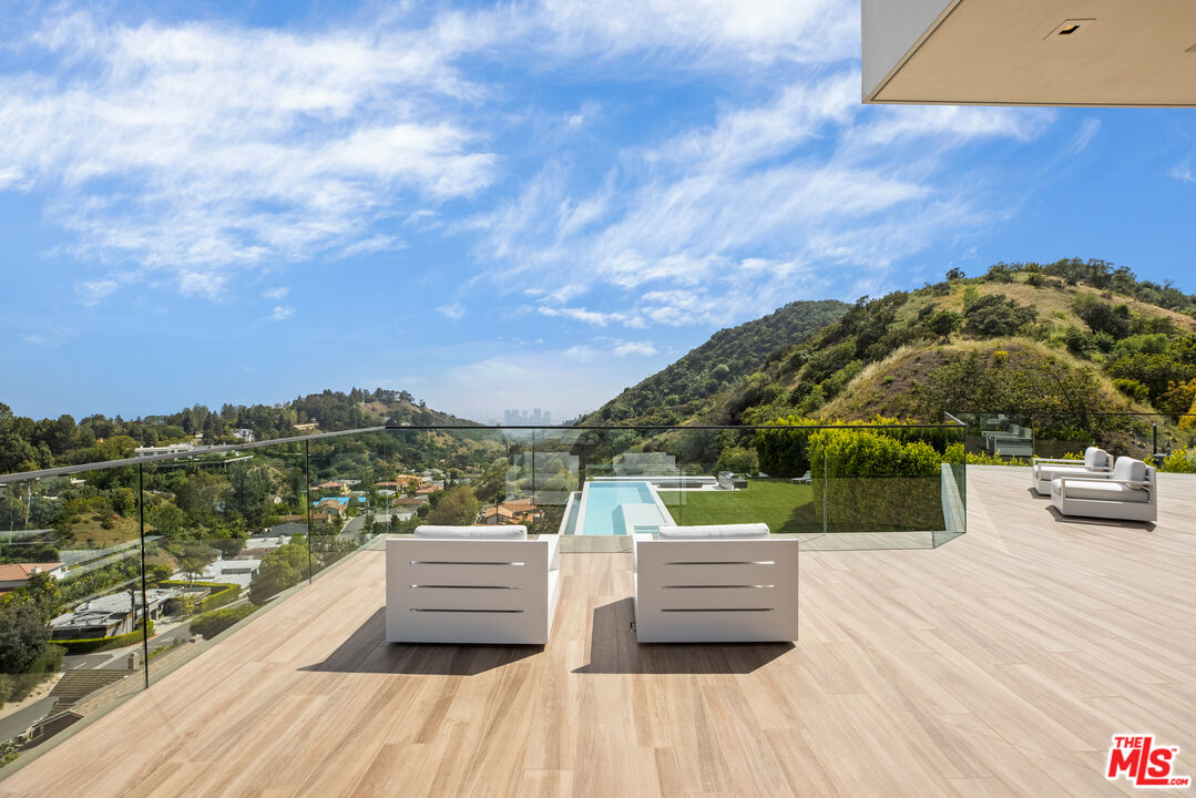 9674 Highridge Drive Beverly Hills, CA 90210 - Photo 16 of 29 a view of roof deck with patio