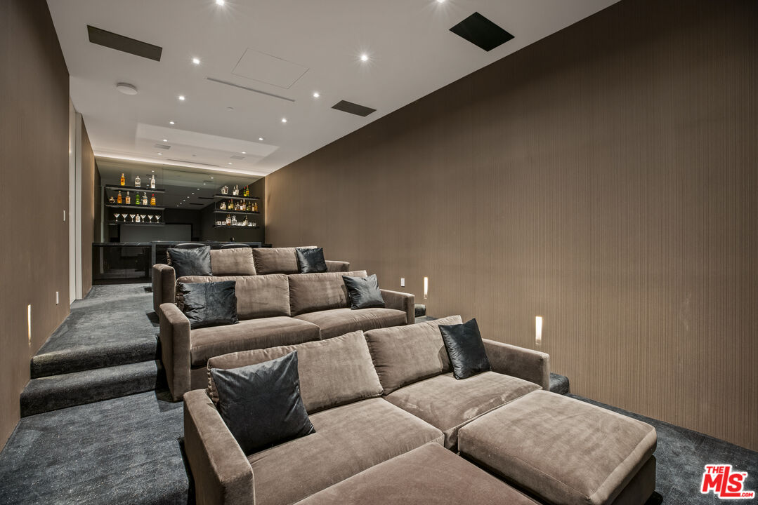 9674 Highridge Drive Beverly Hills, CA 90210 - Photo 21 of 29 a living room with furniture and a couch