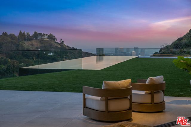 a view of a garden with chairs