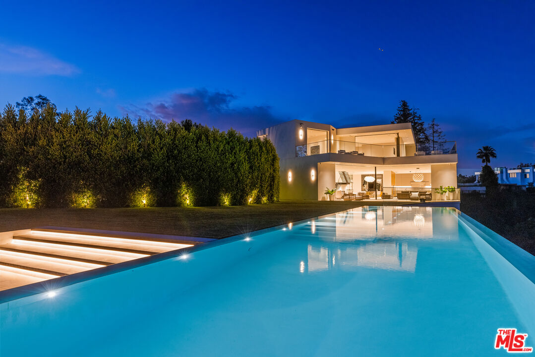 9674 Highridge Drive Beverly Hills, CA 90210 - Photo 24 of 29 a view of a chairs and table on the terrace