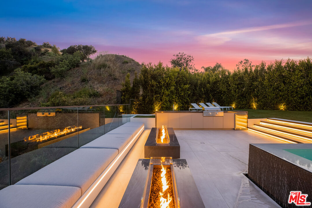 9674 Highridge Drive Beverly Hills, CA 90210 - Photo 25 of 29 a view of swimming pool with a lake