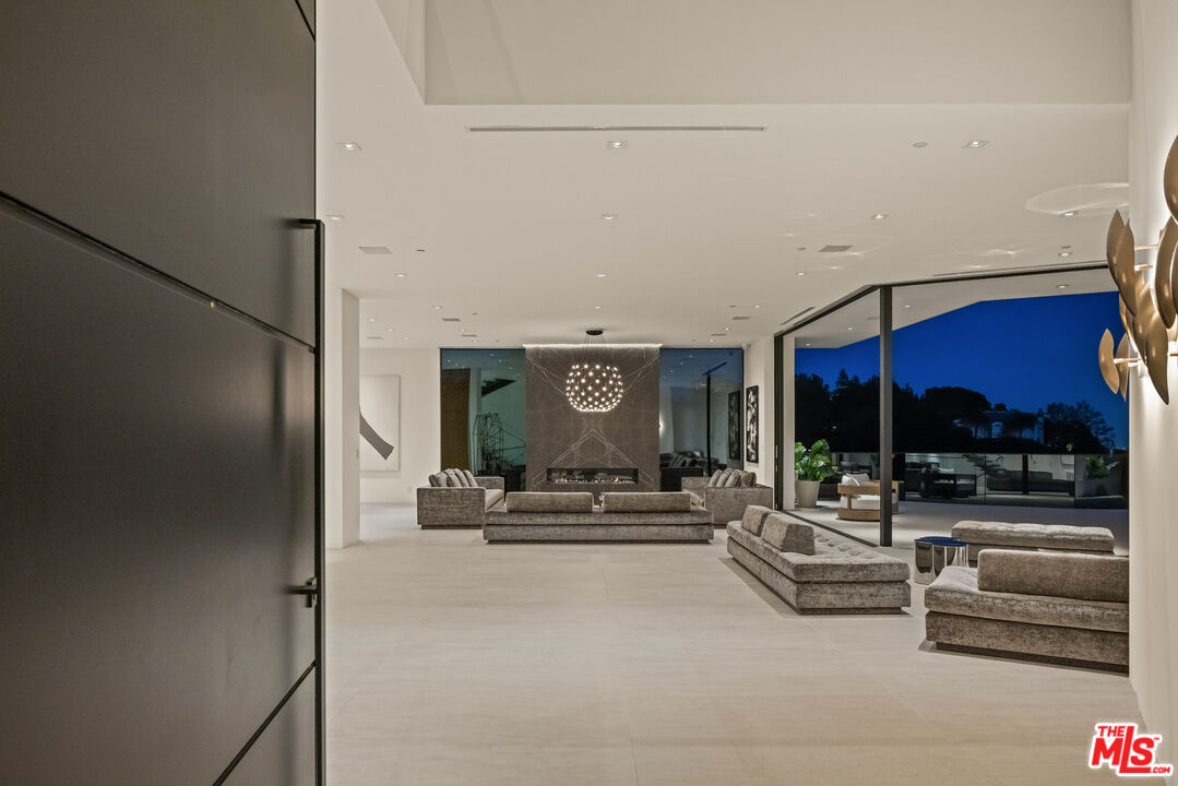 9674 Highridge Drive Beverly Hills, CA 90210 - Photo 3 of 29 a view of a lobby with furniture and white walls