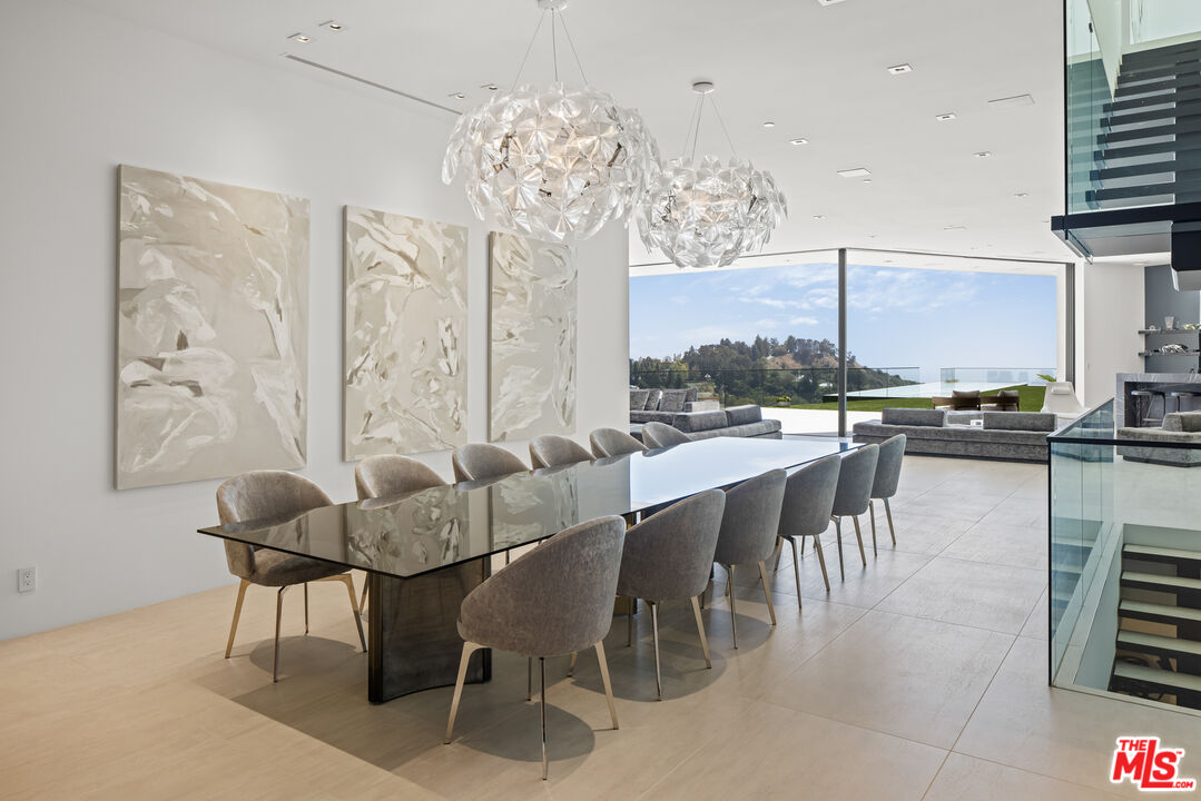 9674 Highridge Drive Beverly Hills, CA 90210 - Photo 8 of 29 a dining room with furniture a chandelier and wooden floor