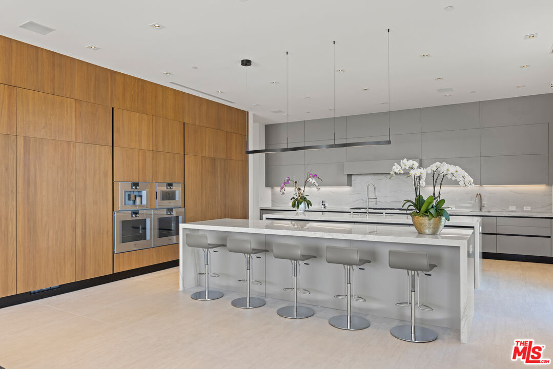 9674 Highridge Drive Beverly Hills, CA 90210 - Photo 9 of 29 a living room with a sink and cabinets